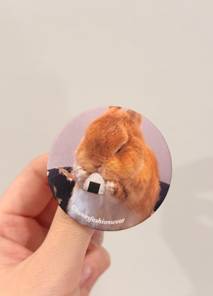 Eggie Eating Onigiri Pin back badge, Matte finish