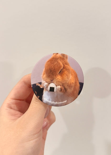 Eggie Eating Onigiri Pin back badge, Matte finish